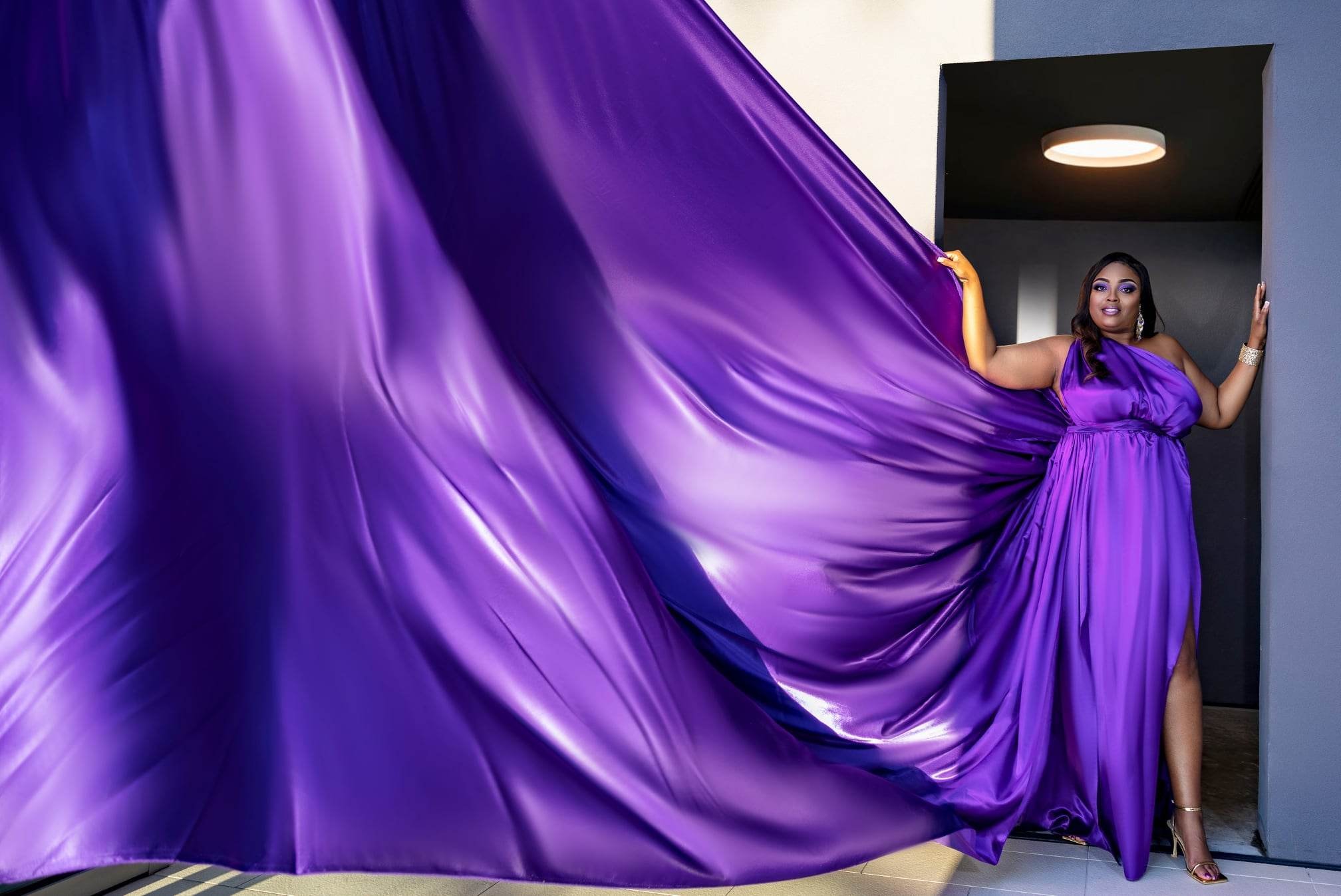 Flying dress — purple gown, architectural backdrop