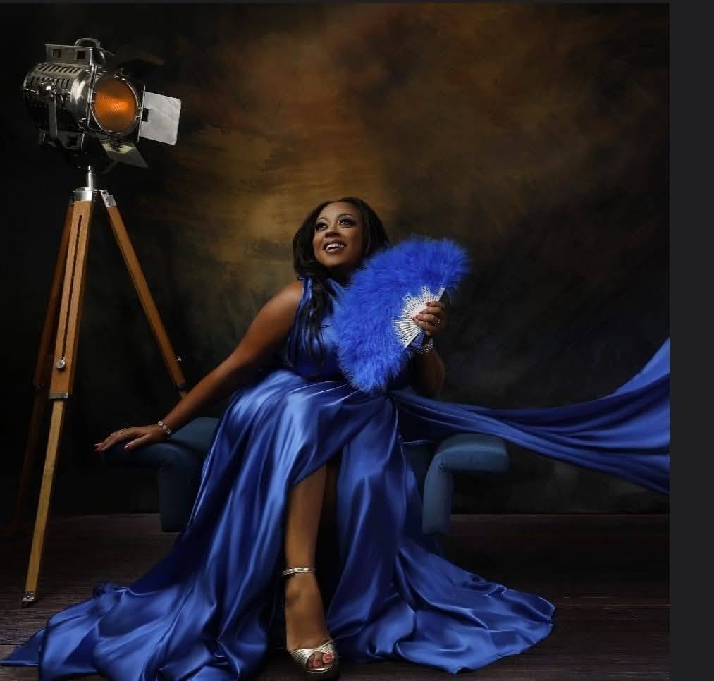 Flying dress — royal blue gown, studio lamp, feather fan